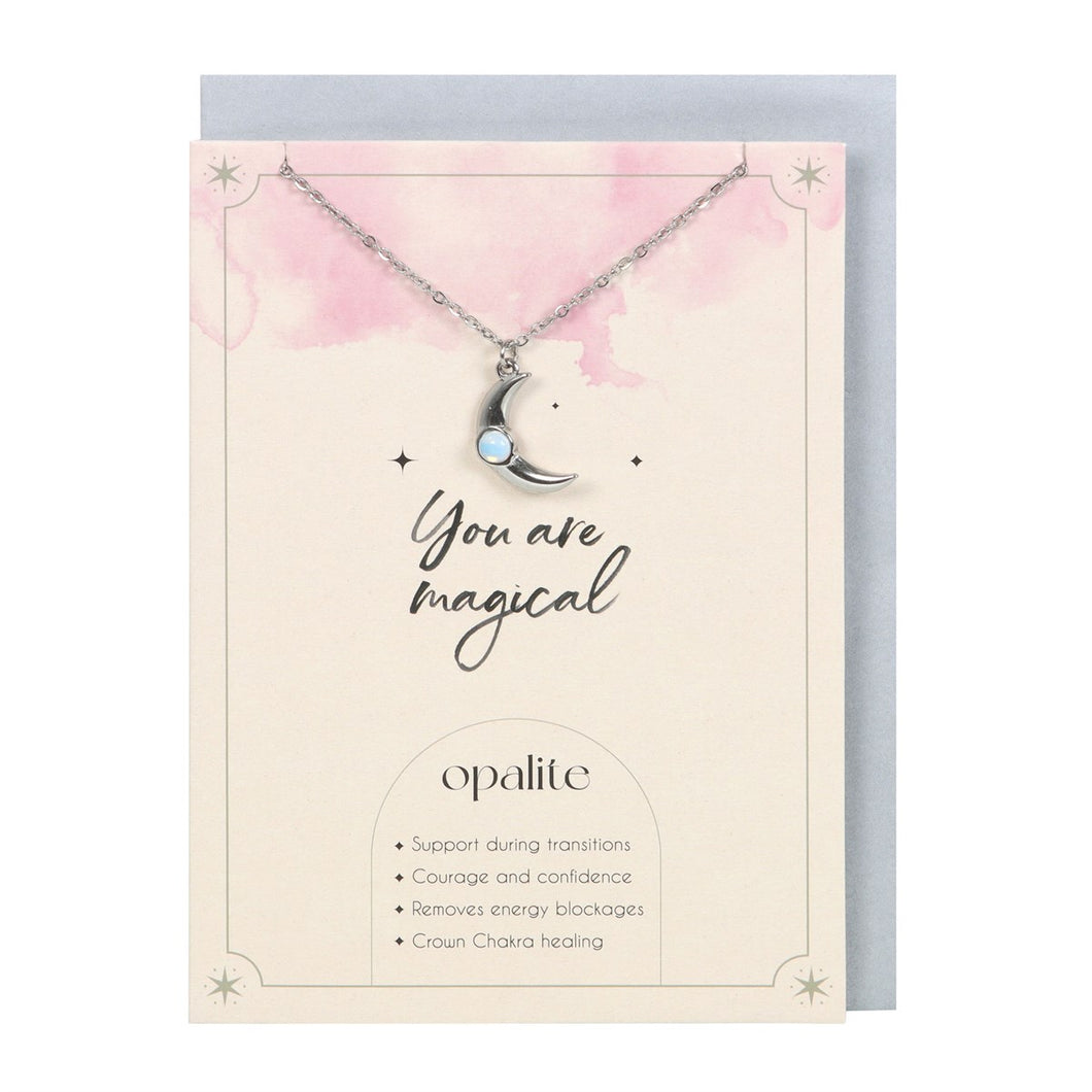 Opalite Crescent Moon Necklace & Card.  This inspiring 'You Are Magic' greeting card features a silver-tone crescent moon necklace accented by an opalite stone. Opalite is a manmade stone reminiscent of opal and moonstone, used to promote courage and remove energy blockages. 22cm chain with lobster clasp closure.