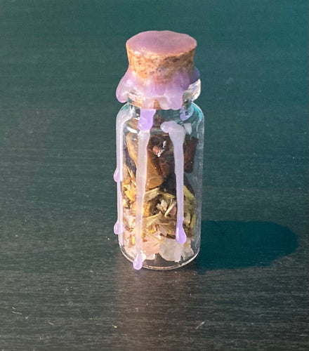 This handmade glass spell jar is for Abundance.  This spell helps to increase your luck and good fortune.  It contains pink salt, star anise, barberry bark, lemon oil and tigers eye chips and is sealed with purple candle wax.  Keep this jar in your bag, or by a window or doorway to bring you a flow of good fortune.