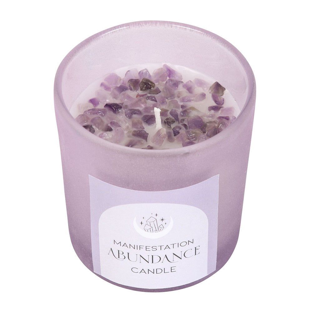 Abundance French Lavender Crystal Chip Candle.  Manifest abundance with this stunning French Lavender fragranced candle. A purple frosted glass holder and metallic lid are accented by a scattering of amethyst crystal chips that can later be reused for a multitude of spiritual purposes. 